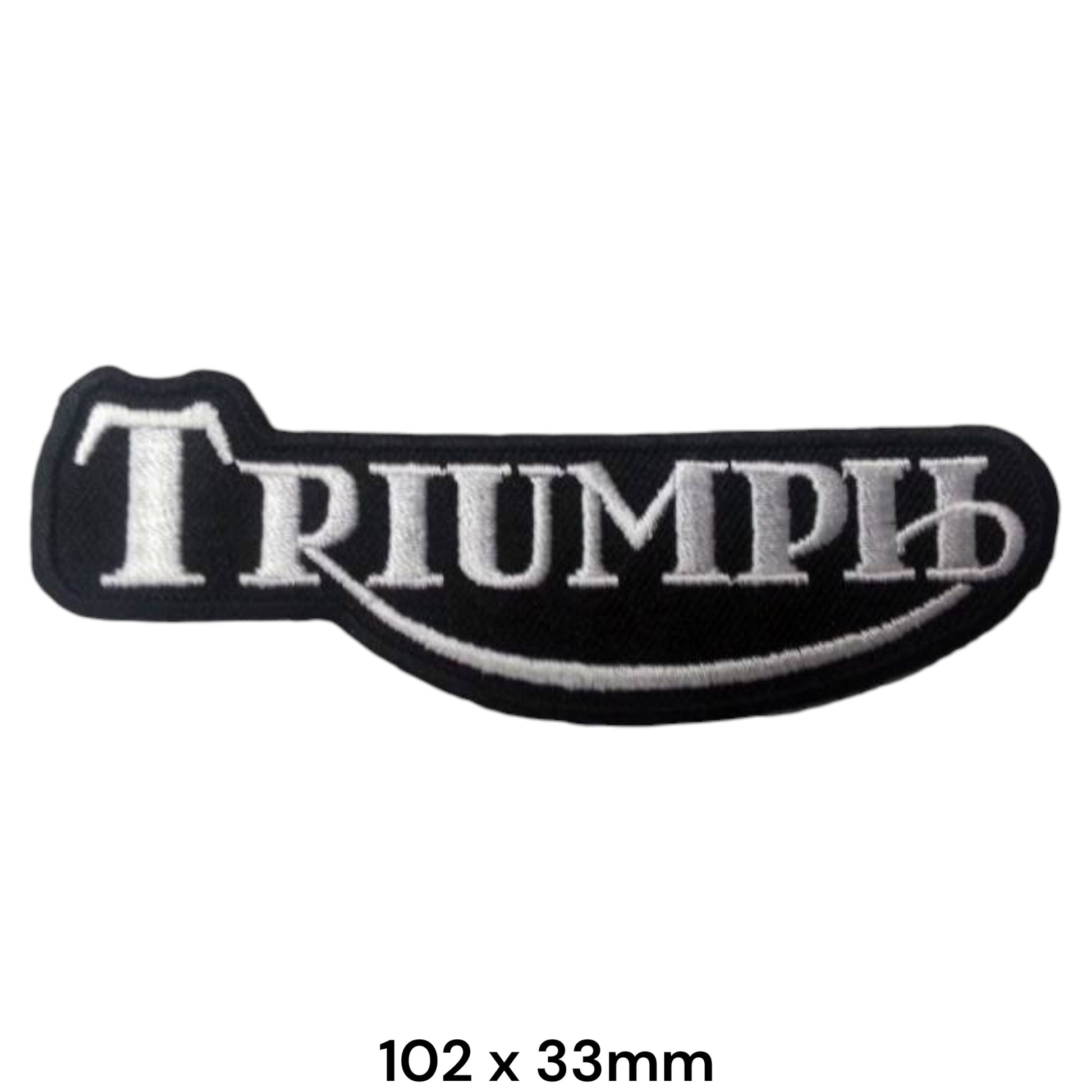 Triumph Silver Tank Badge Embroidered Patch 102x33mm – shaped black tank-badge silhouette with bold silver-white Triumph serif lettering, silver swoosh underline and silver border