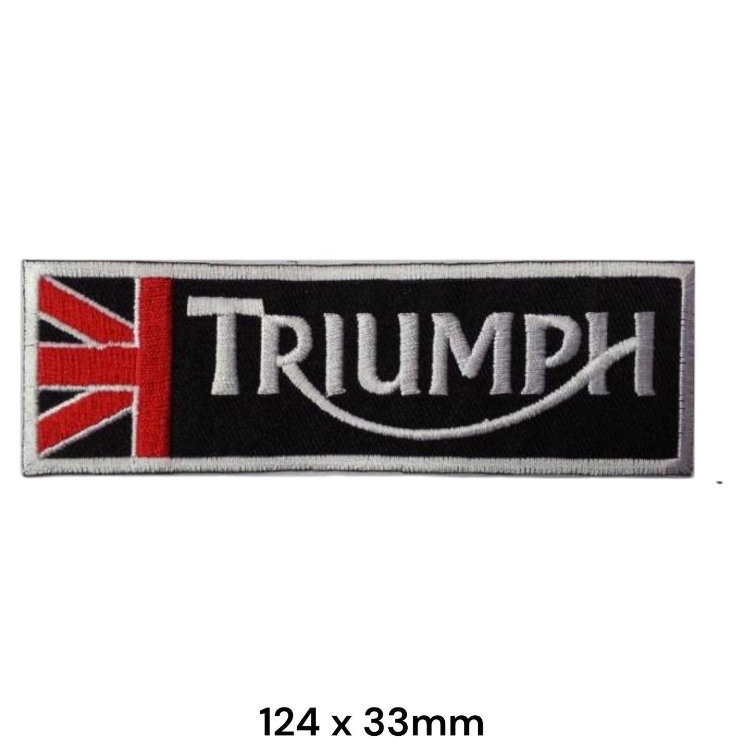 Triumph Union Jack Black Strip Embroidered Patch 124x33mm – black rectangular badge with red & white Union Jack section, red vertical divider, silver-white Triumph serif lettering and white swoosh underline