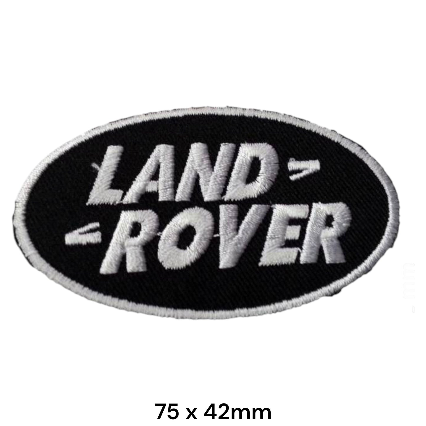 Land Rover Oval Black & White Embroidered Patch 75x42mm – black oval badge with bold silver-white Land Rover block lettering and white border