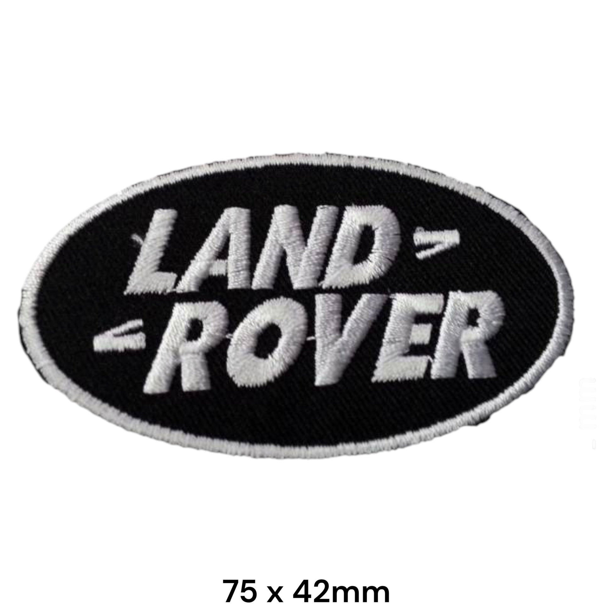 Land Rover Oval Black & White Embroidered Patch 75x42mm – black oval badge with bold silver-white Land Rover block lettering and white border